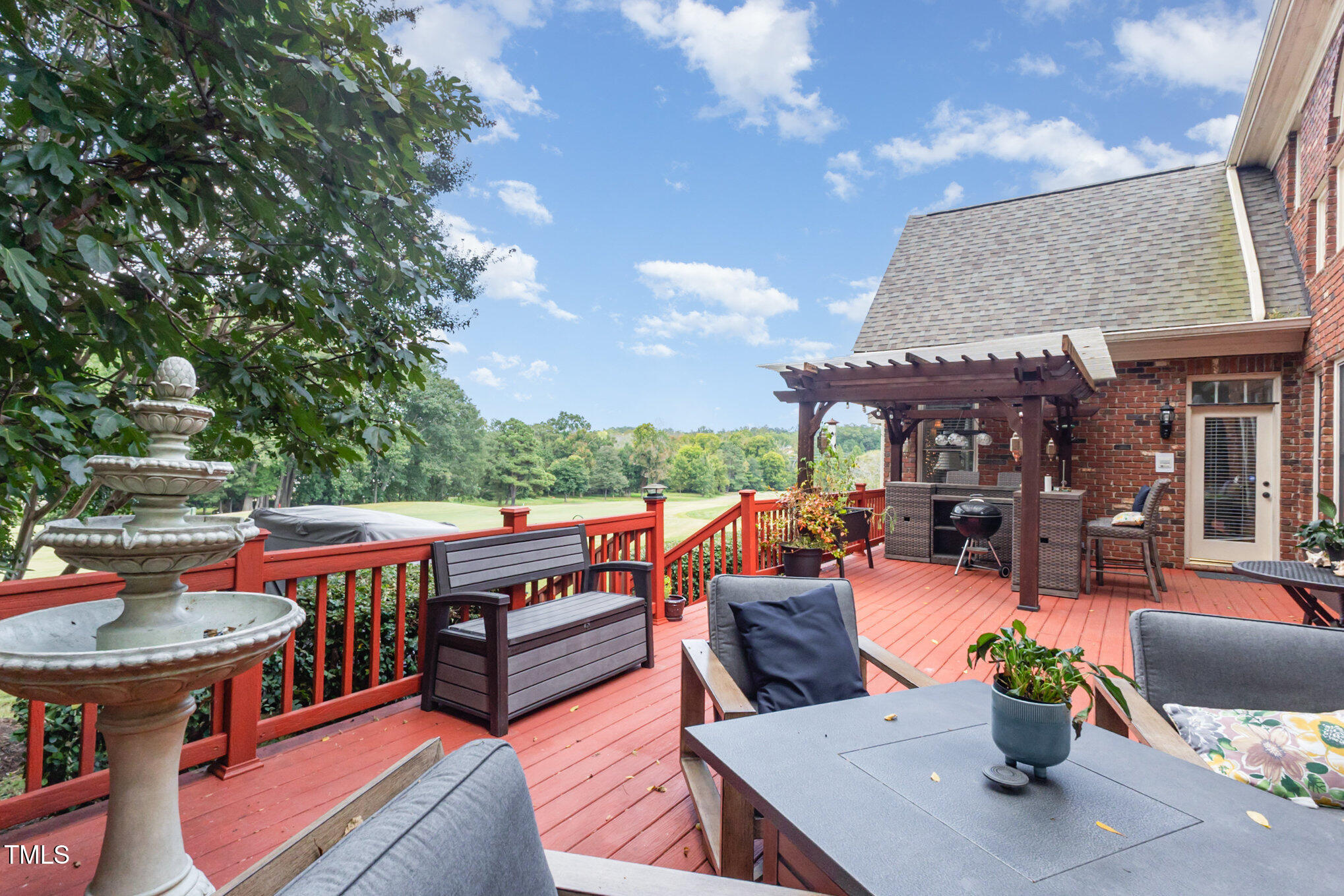 12617 Richmond Run Drive Raleigh, NC 27614 - Photo 58 of 77 a view of a patio with couches table and chairs and potted plants