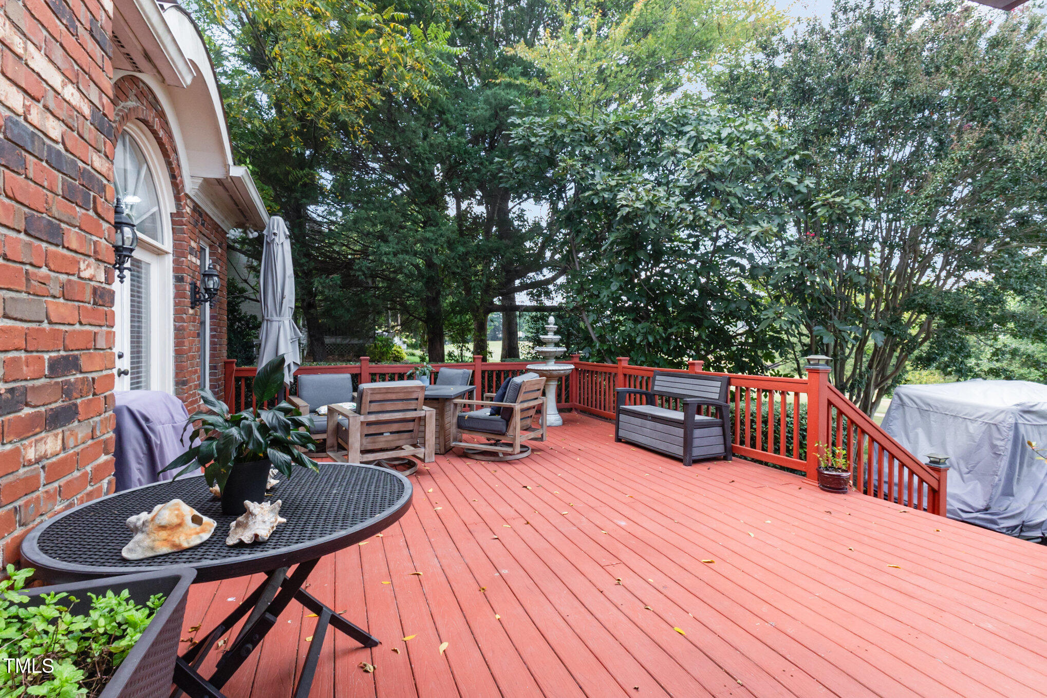 12617 Richmond Run Drive Raleigh, NC 27614 - Photo 60 of 77 a view of a patio with table and chairs potted plants with wooden floor and fence