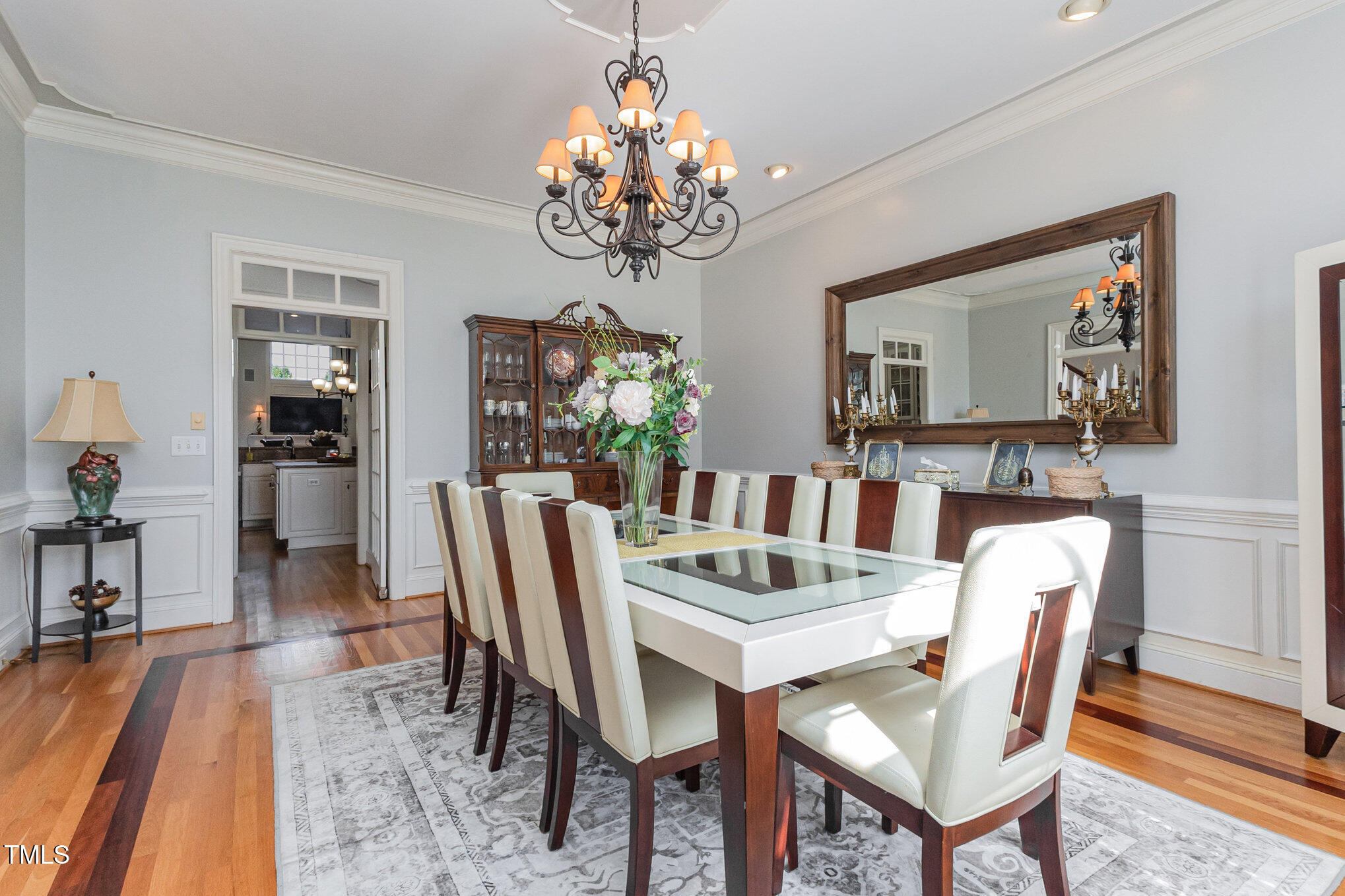 12617 Richmond Run Drive Raleigh, NC 27614 - Photo 7 of 77 a view of a dining room with furniture wooden floor and chandelier