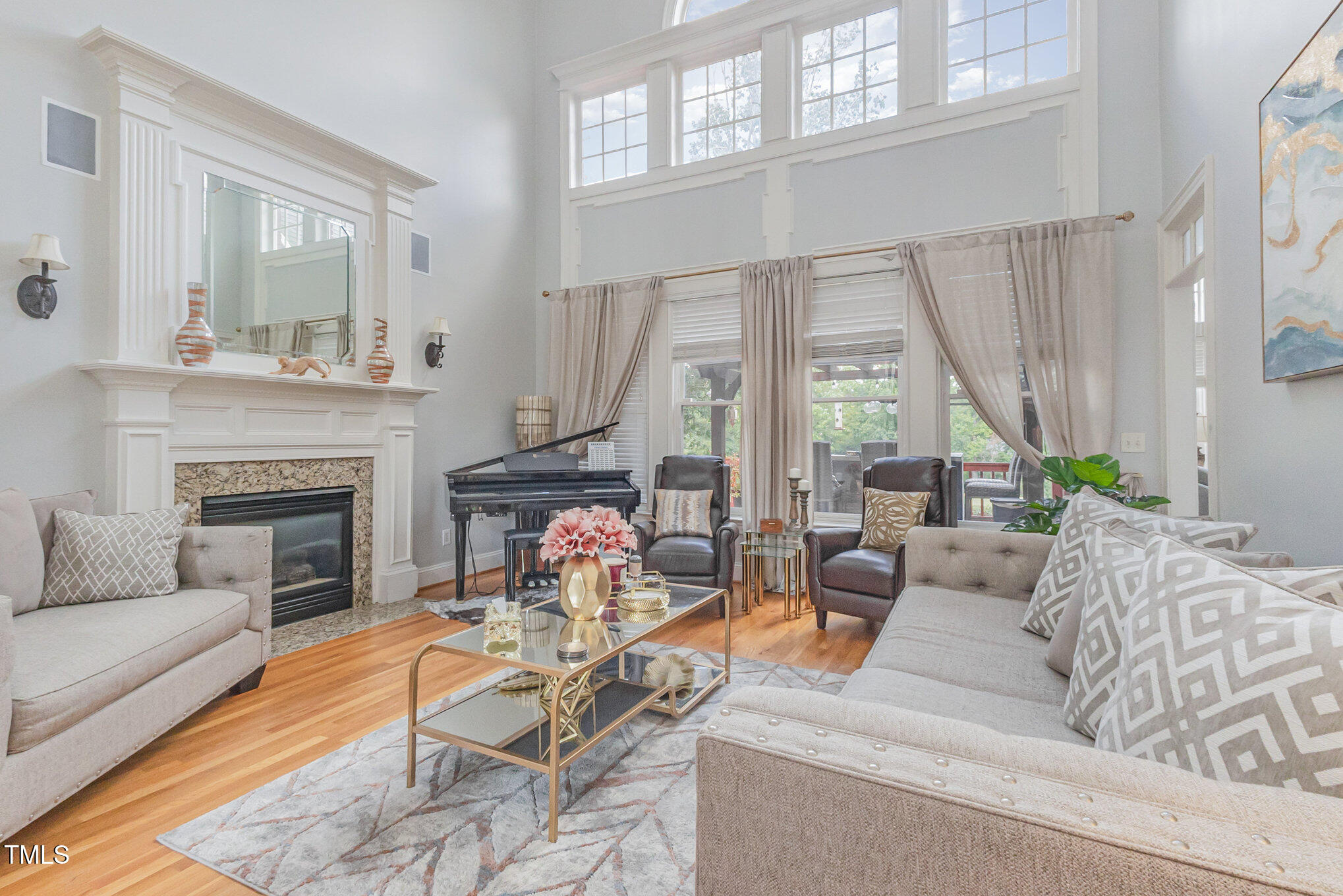 12617 Richmond Run Drive Raleigh, NC 27614 - Photo 8 of 77 a living room with furniture fireplace and a large window
