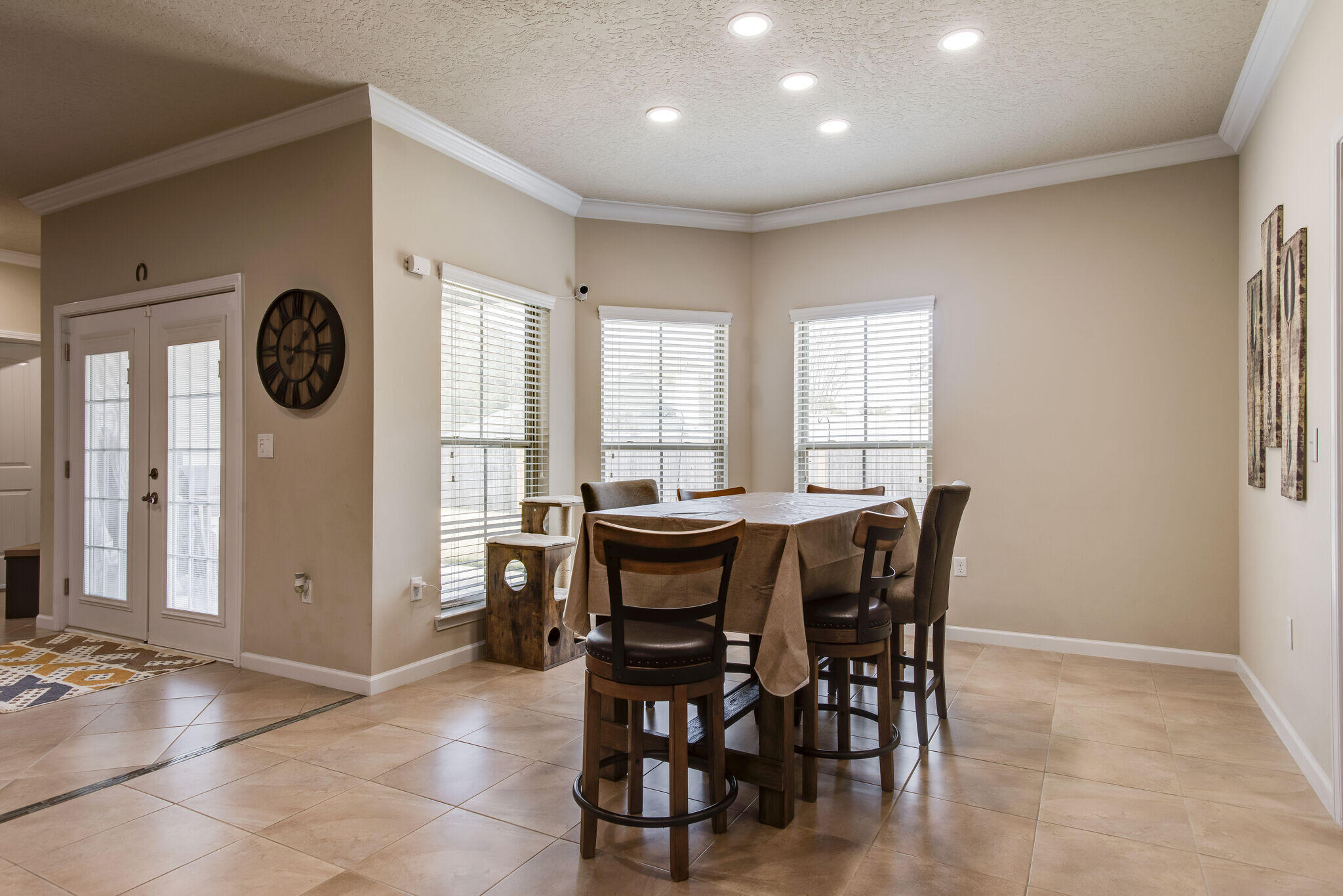 4600 Hermosa Road Crestview, FL 32539 - Photo 16 of 28 a view of a dining room with furniture and a large window