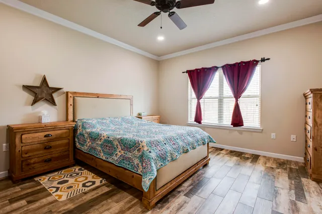 a bedroom with a bed and a dresser