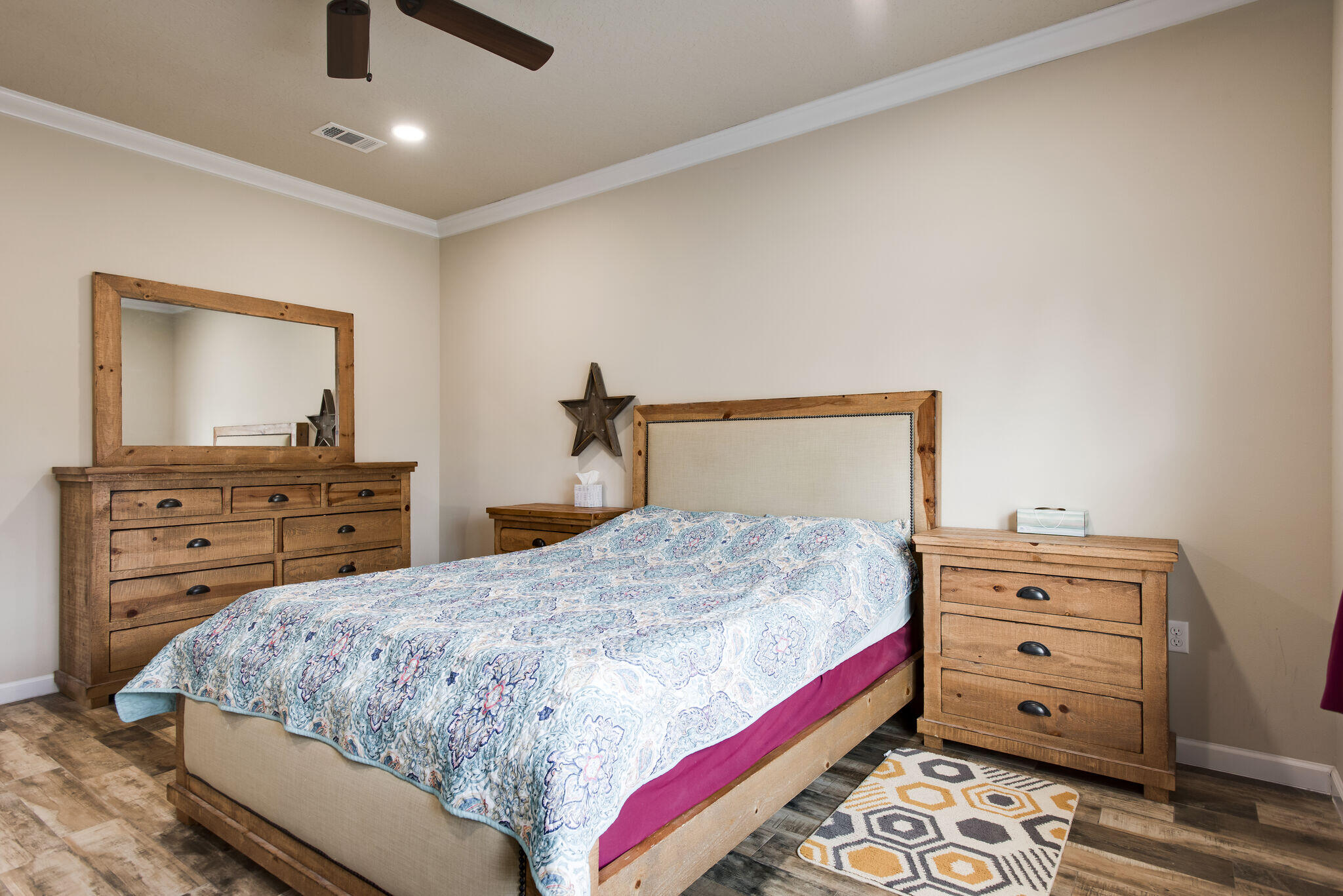 4600 Hermosa Road Crestview, FL 32539 - Photo 18 of 28 a bedroom with a bed and a dresser