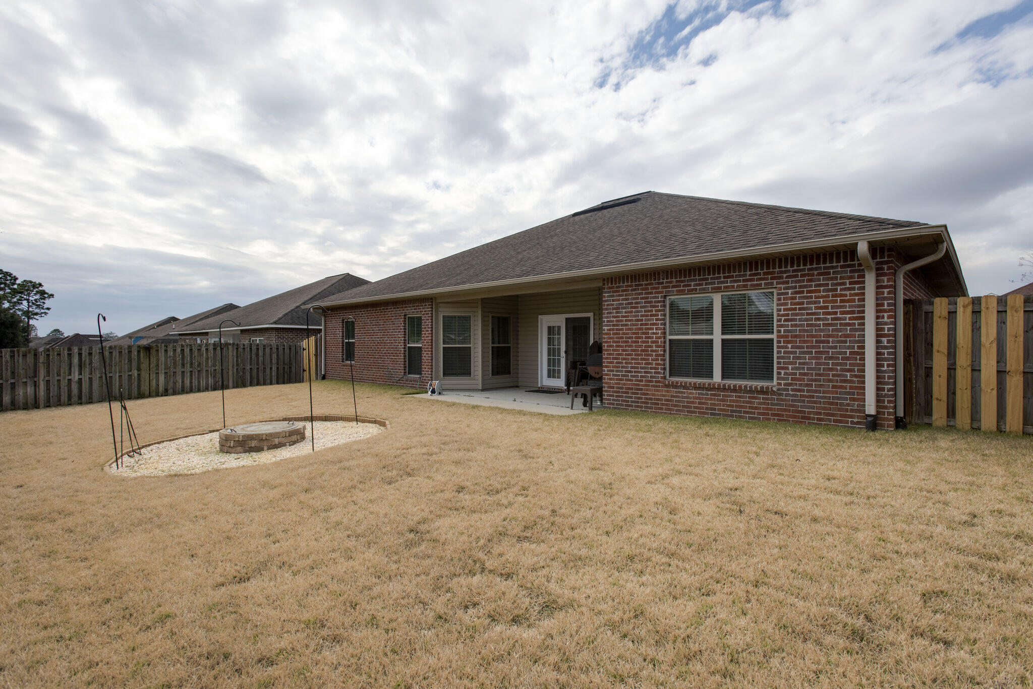 4600 Hermosa Road Crestview, FL 32539 - Photo 27 of 28 a house with trees in front of it