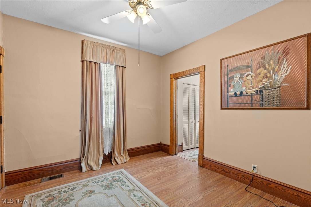 1011 Parriott Avenue Moundsville, WV 26041 - Photo 17 of 44 Unfurnished room featuring light wood-type flooring and ceiling fan