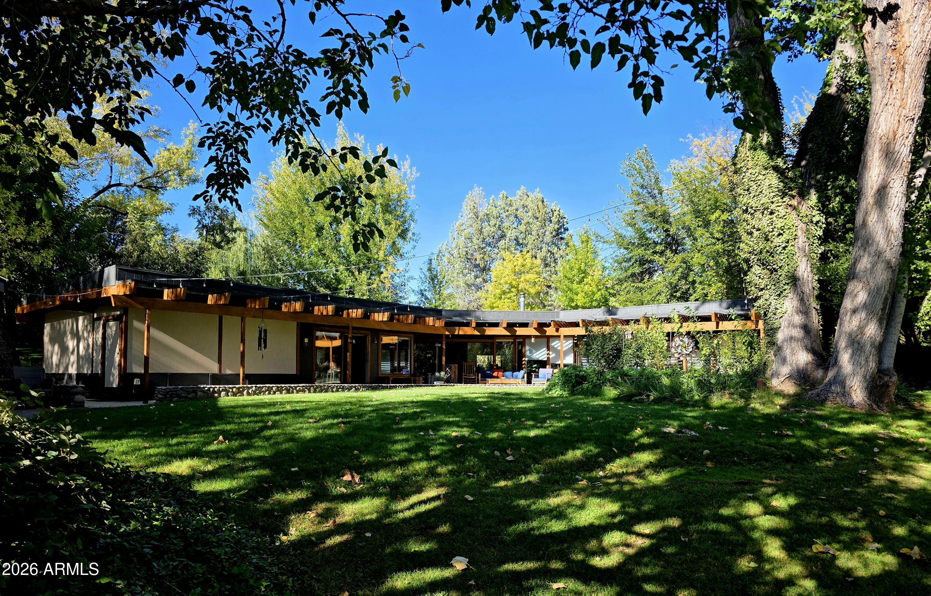 a view of a house with a small yard
