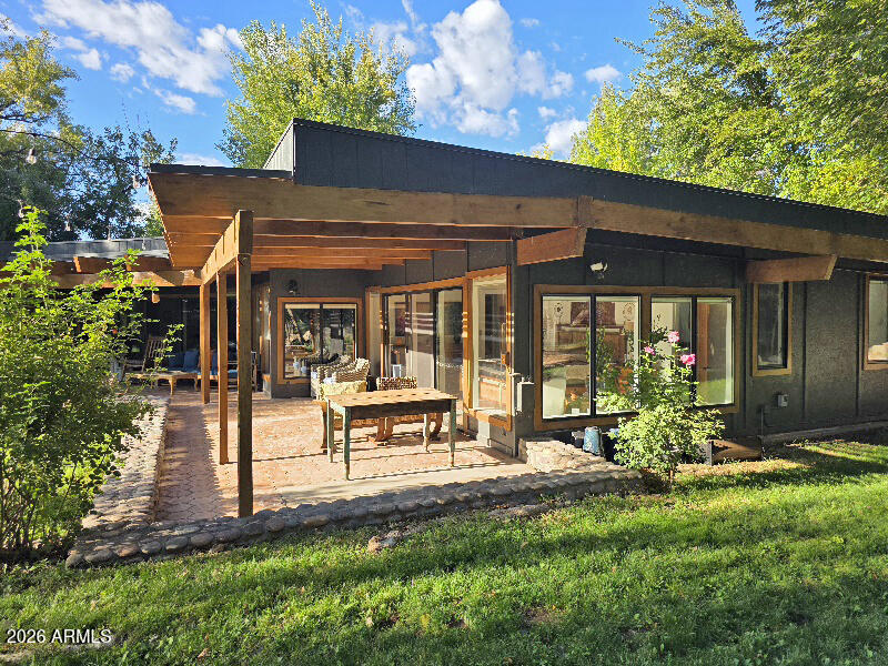 1225 East Willow Point Road Cornville, AZ 86325 - Photo 2 of 132 a view of a house with backyard porch and sitting area