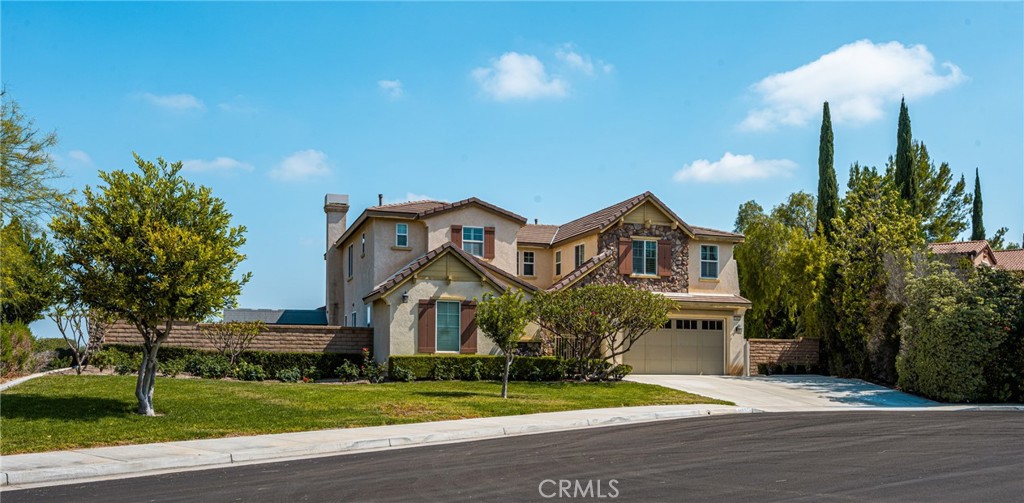12652 Twin Peak Court Riverside, CA 92503 - Photo 54 of 55 a front view of a house with a yard and garage