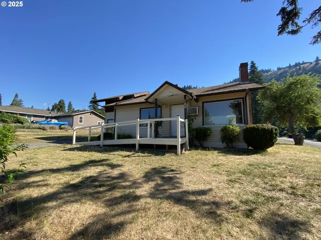 a house with trees in the background