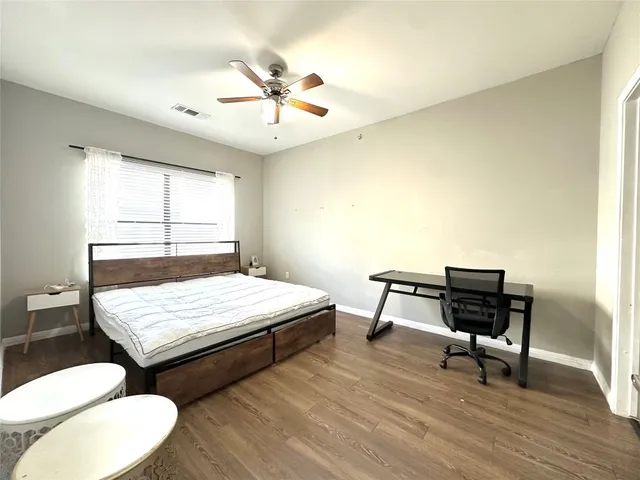 a bedroom with a bed and a table
