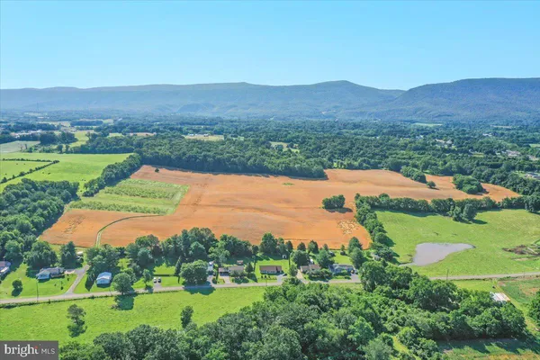 an aerial view of a house with mountain view
