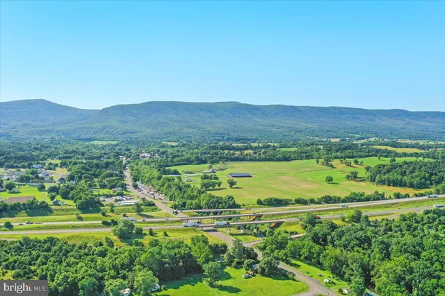 a view of a city with mountains in the background