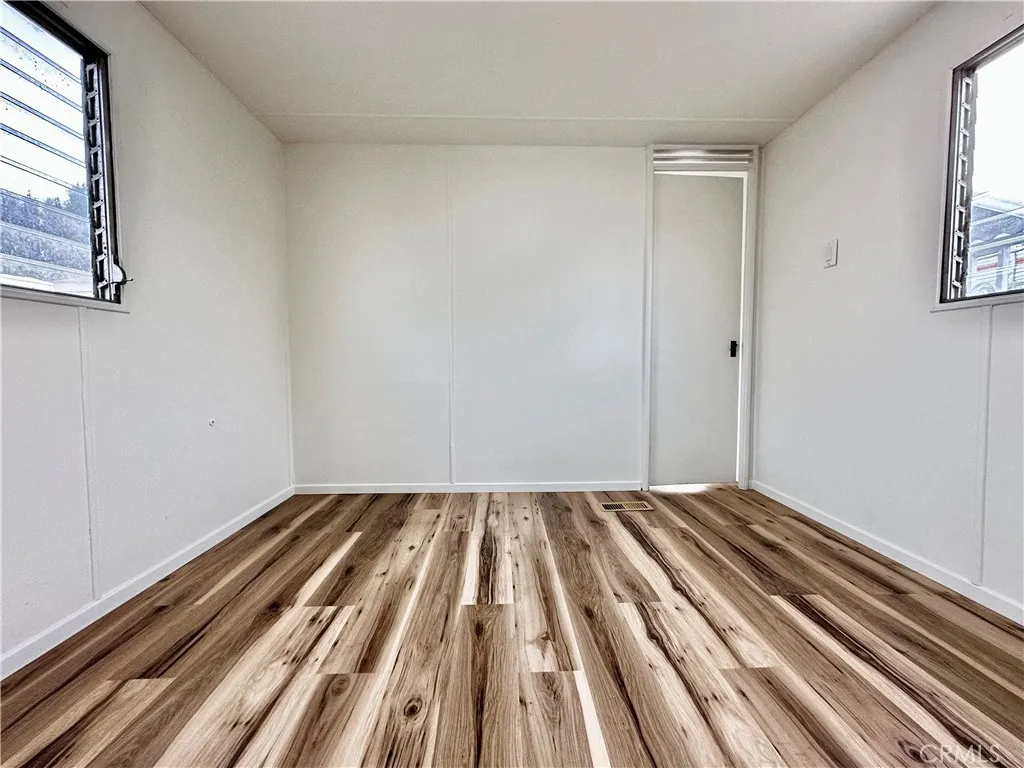 6426 Valley View Drive, Unit 9 Joshua Tree, CA 92252 - Photo 11 of 23 a view of wooden floor in a room