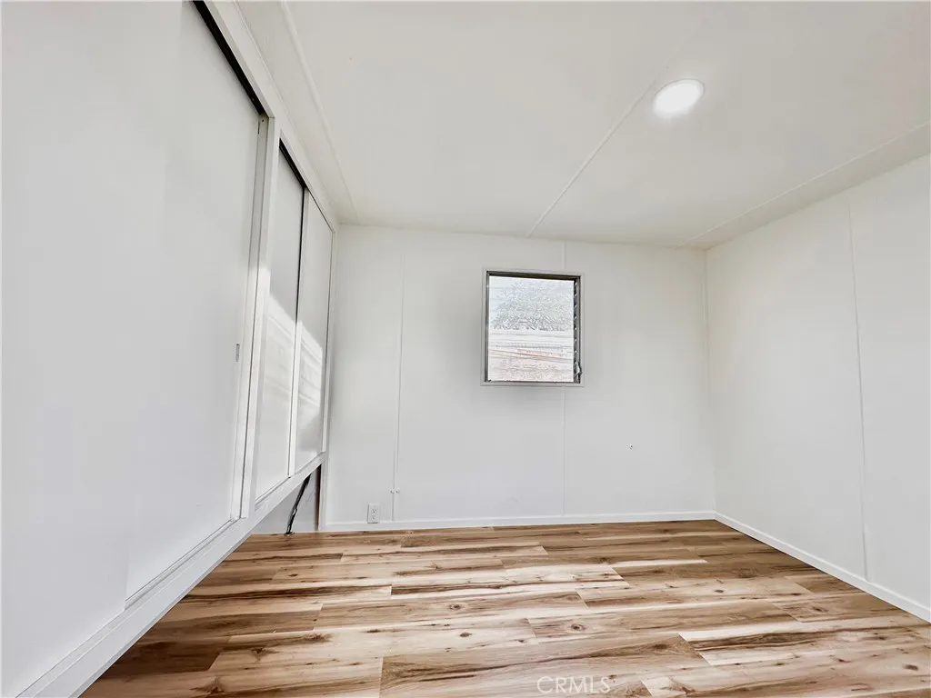 6426 Valley View Drive, Unit 9 Joshua Tree, CA 92252 - Photo 7 of 23 a view of empty room with wooden floor