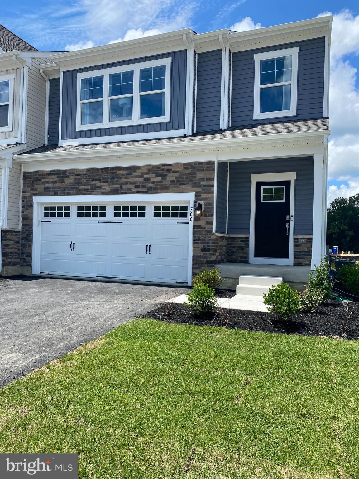 a view of house with yard and outdoor space