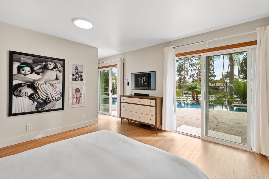 612 Lucylle Lane Encinitas, CA 92024 - Photo 17 of 47 a view of a bedroom with furniture and window