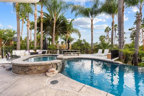 a view of a swimming pool with a patio