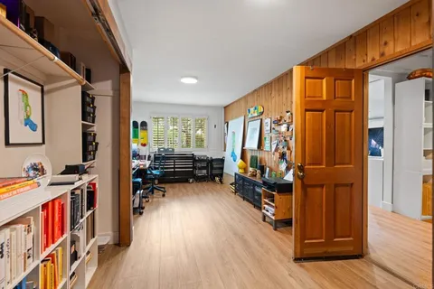 a view of room with furniture and wooden floor