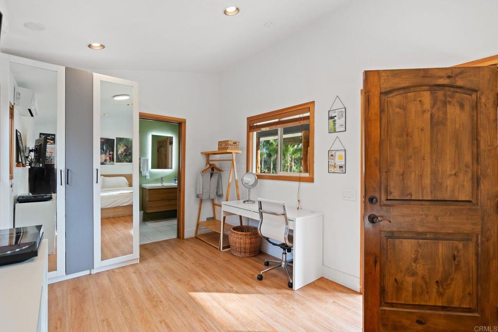 612 Lucylle Lane Encinitas, CA 92024 - Photo 27 of 47 a bedroom with furniture and a window