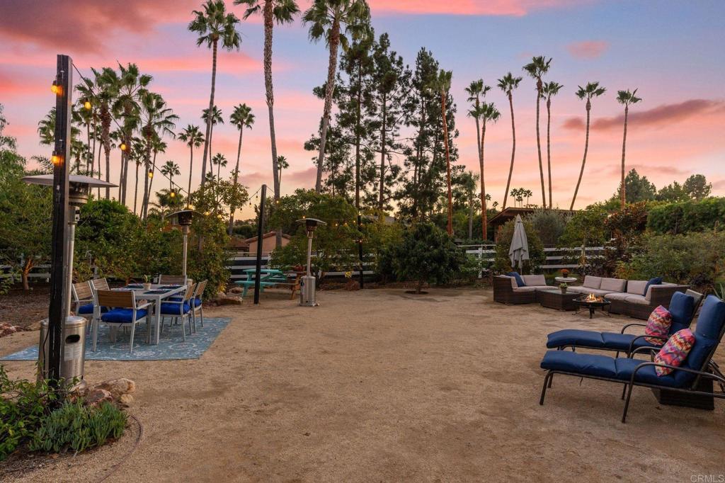612 Lucylle Lane Encinitas, CA 92024 - Photo 37 of 47 a view of a swimming pool with a table and chairs