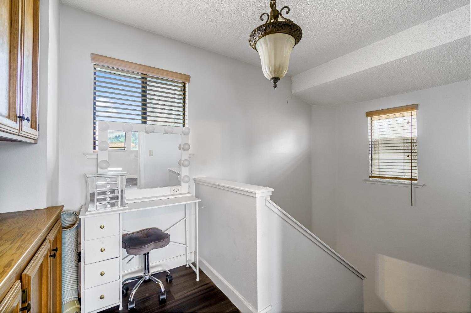 901 Valley Way Madera, CA 93637 - Photo 23 of 42 a bathroom with a sink a mirror and a window