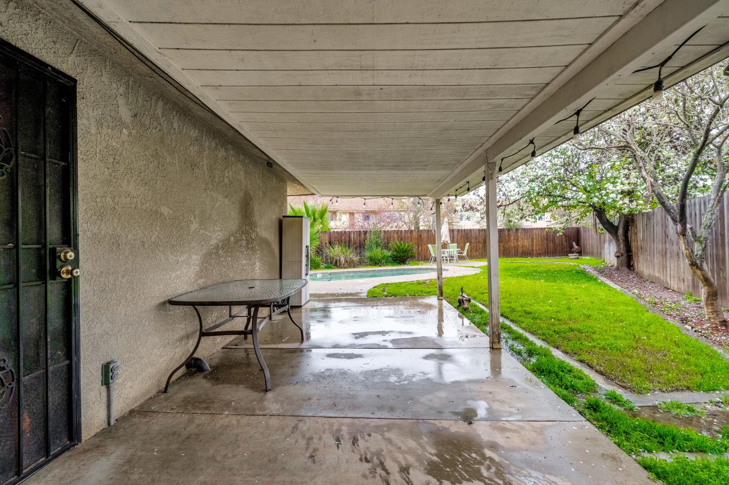901 Valley Way Madera, CA 93637 - Photo 28 of 42 a view of a porch with furniture and garden