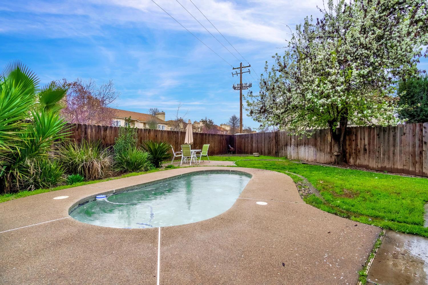 901 Valley Way Madera, CA 93637 - Photo 29 of 42 a view of a swimming pool with a yard