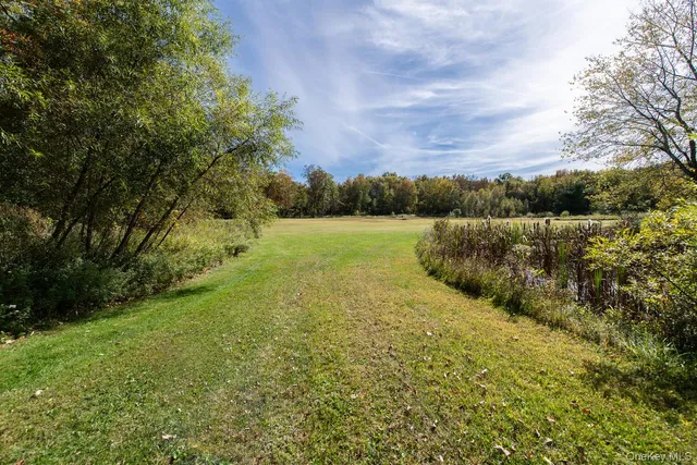 a view of an lake and a yard