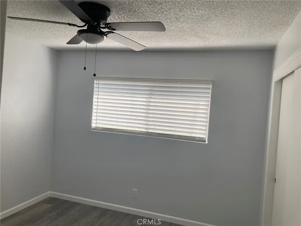 a bathroom with a sink a toilet and window