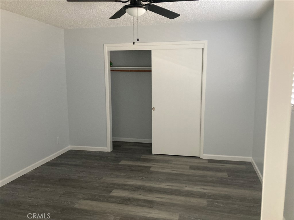 409 West Perdew Avenue Ridgecrest, CA 93555 - Photo 7 of 14 a view of an empty room with wooden floor