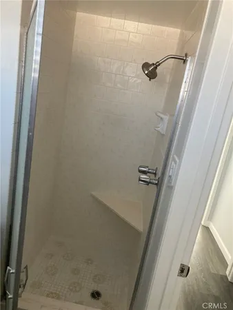 a bathroom with a toilet sink vanity and mirror