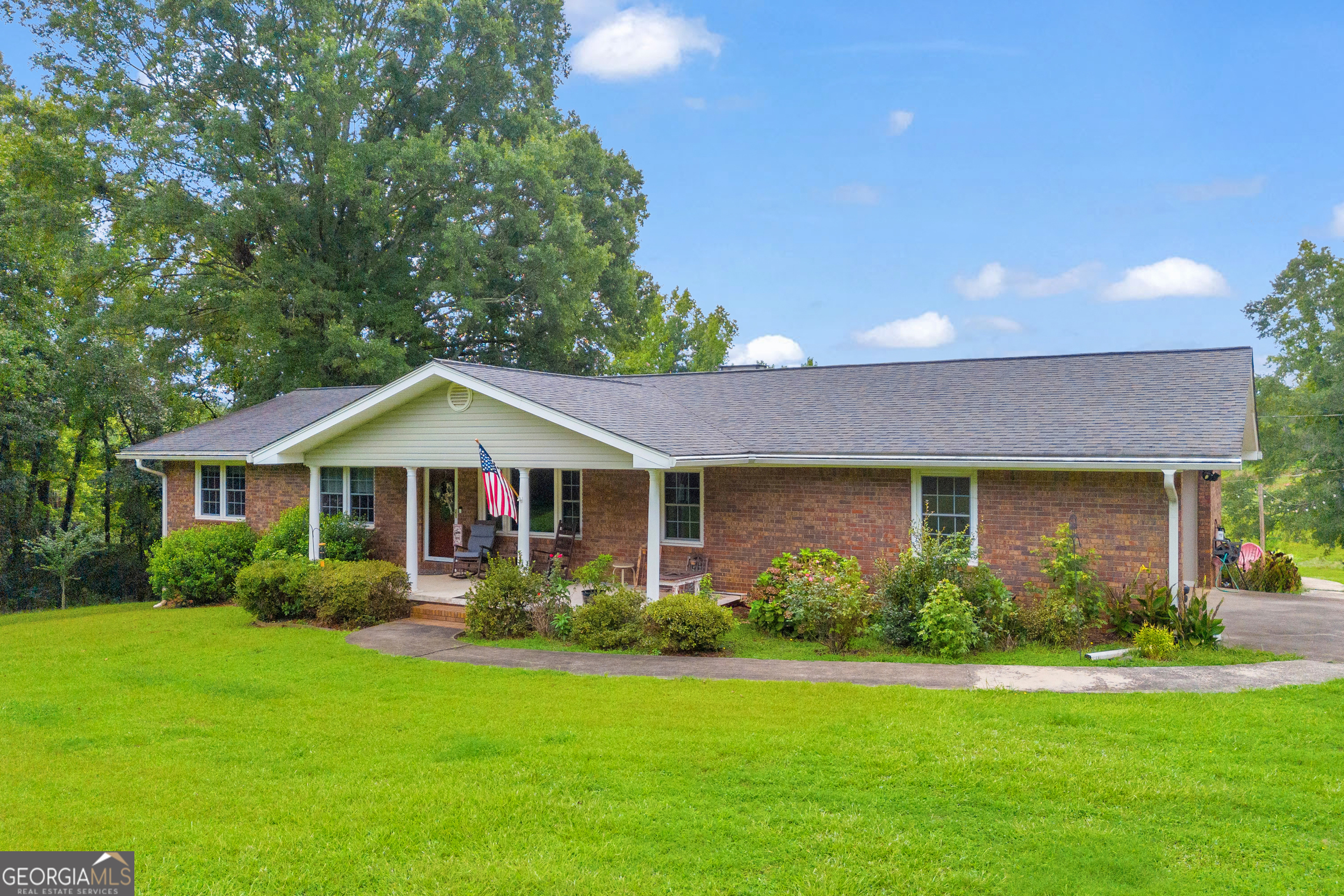 2740 Sanford Road Nicholson, GA 30565 - Photo 1 of 1 a front view of house with yard and green space