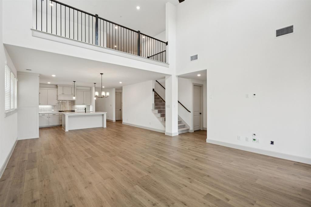 4180 Kestrel Street Prosper, TX 75078 - Photo 9 of 23 a view of an entryway with wooden floor