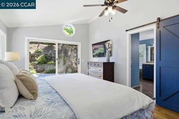a bedroom with a bed dresser and a window
