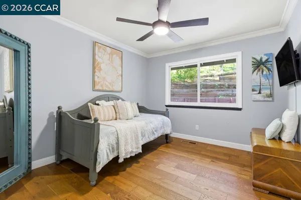 a bed room with furniture and a window