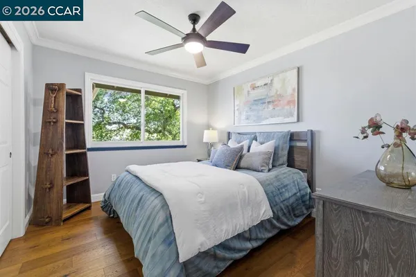a bedroom with a large bed and a large window