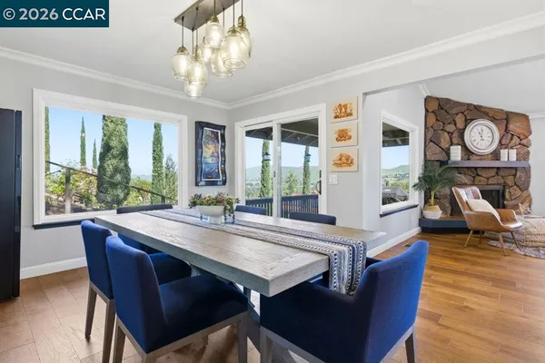 a view of a dining room with furniture window and outside view