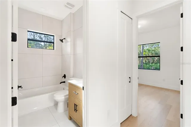 a view of a big room with chandelier and bathroom