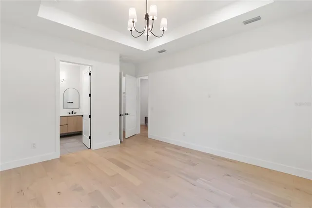 a bathroom with a double vanity sink a mirror and vanity