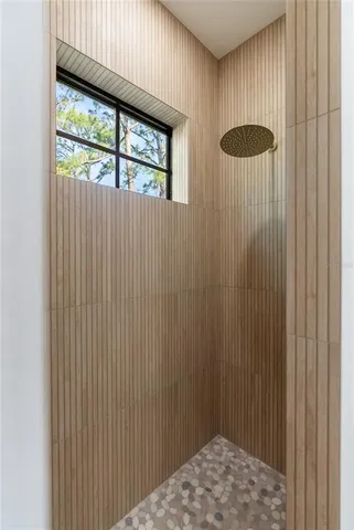 a large kitchen with stainless steel appliances granite countertop a sink a stove and a refrigerator