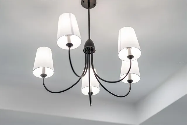 a kitchen with a sink a microwave and cabinets