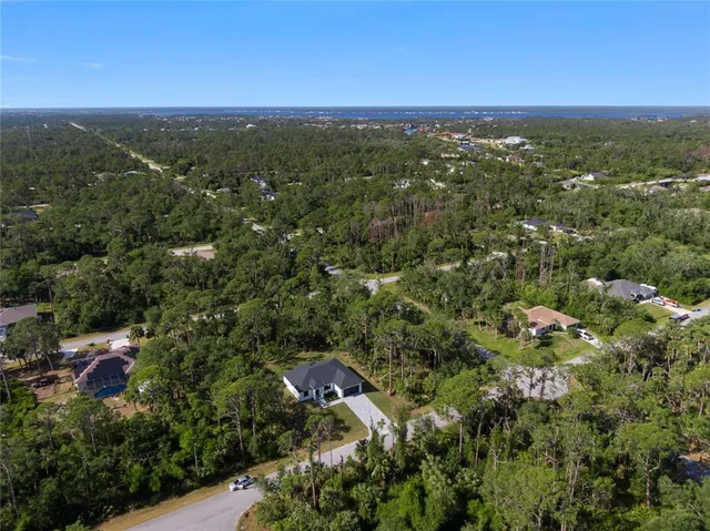 an aerial view of house with yard