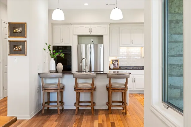 a kitchen with a table and chairs in it