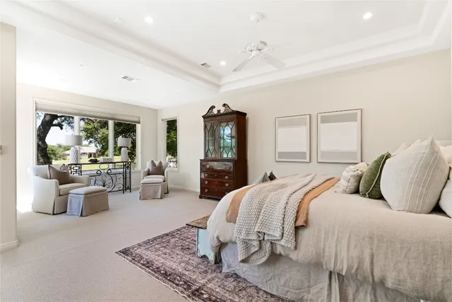 a living room with furniture and a dining table