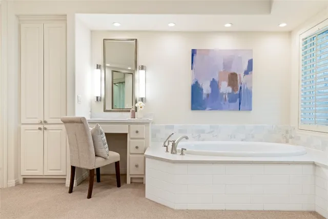 a bathroom with a bathtub and a window