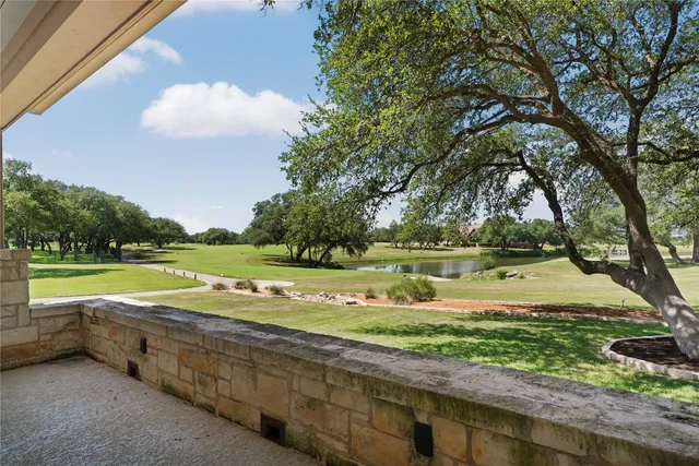 a view of a swimming pool with an outdoor space and seating area