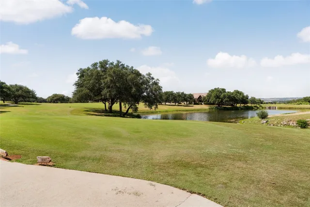 a view of a lake with houses in the back