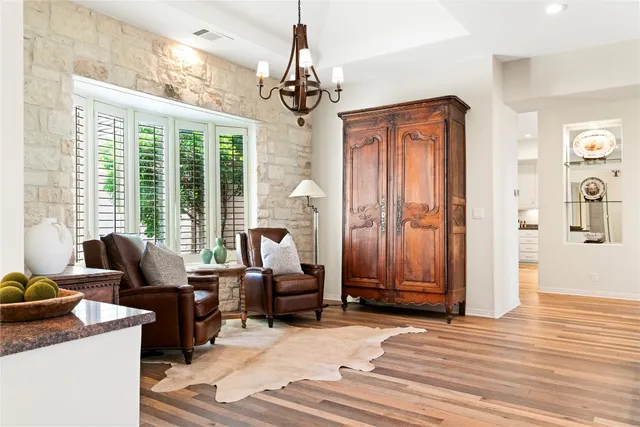 a living room with furniture windows and wooden floor