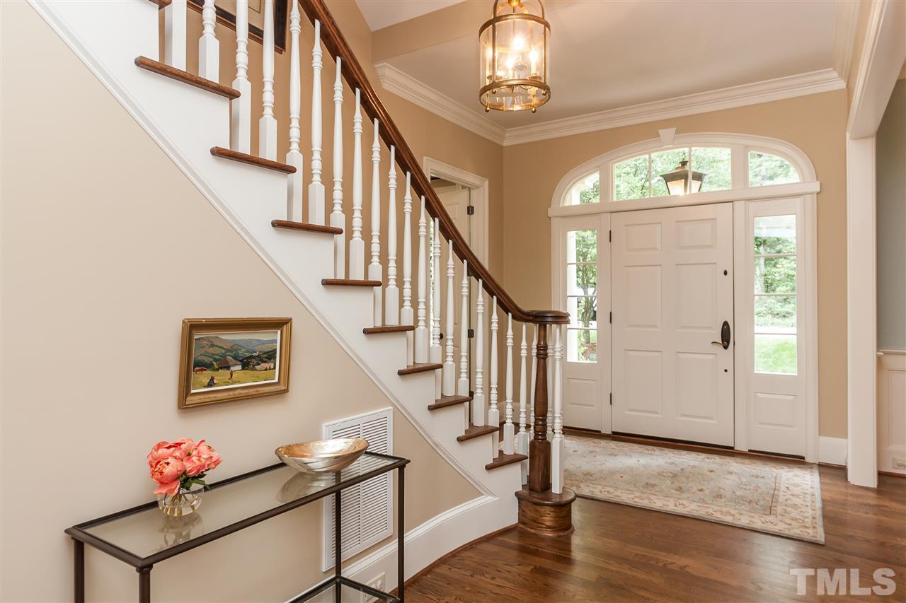 607 Runnymede Road Raleigh, NC 27607 - Photo 2 of 25 a view of entryway and hall with wooden floor