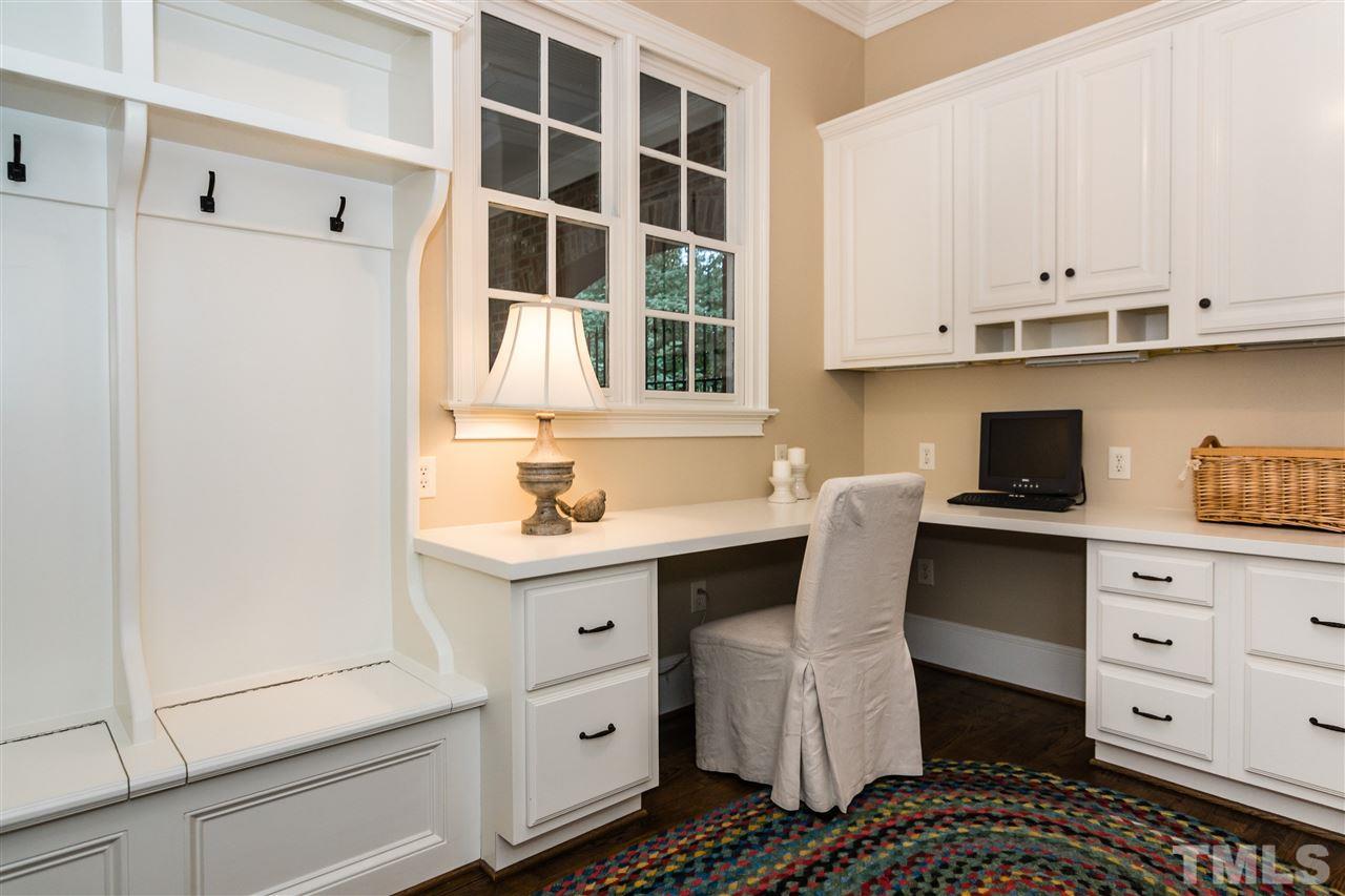 607 Runnymede Road Raleigh, NC 27607 - Photo 11 of 25 a kitchen with a cabinets and window